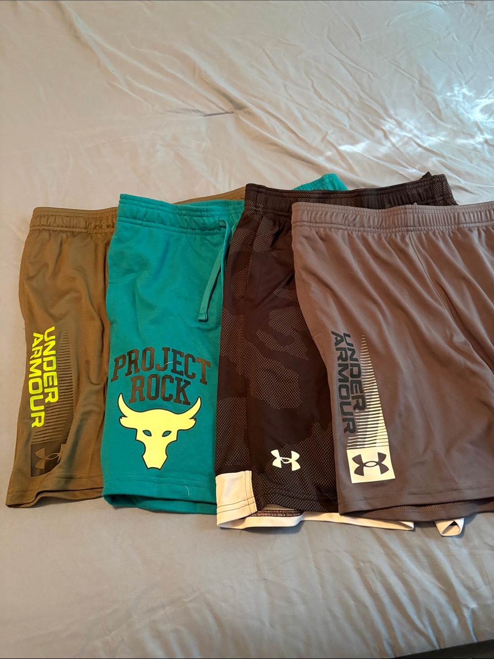 Lot of 4 pair Under Armour Kids' Athletic Shorts - Teal, Brown, Black, Olive